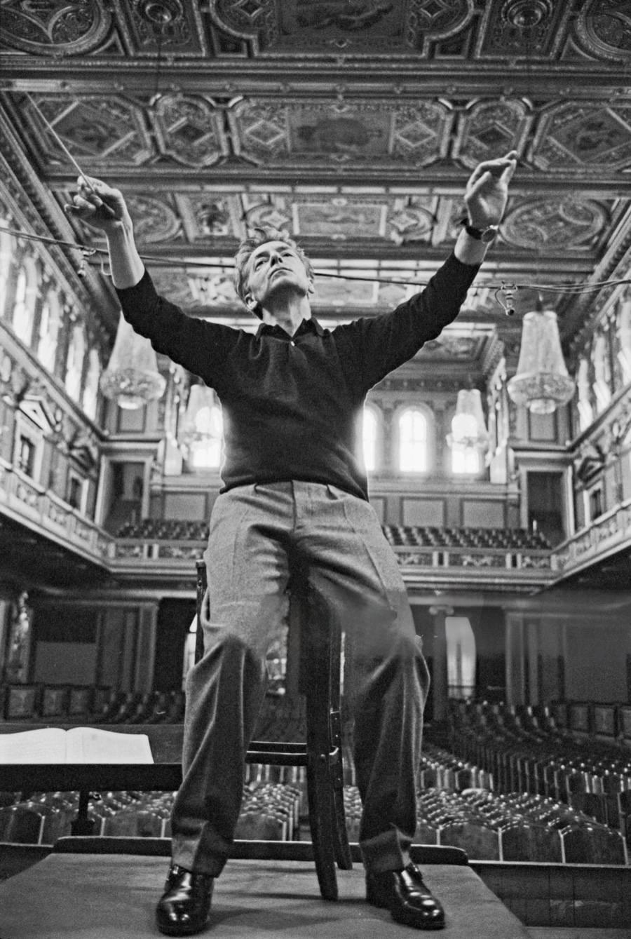 A conductor leading an orchestra